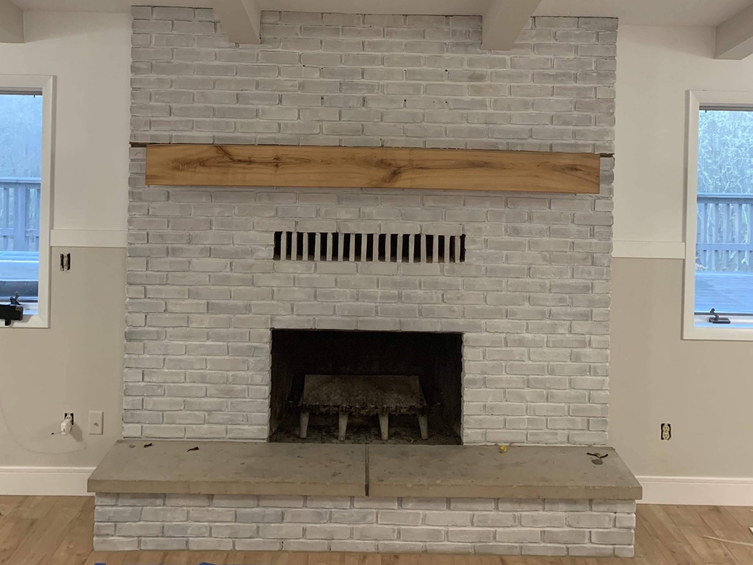 Highlighting a brand new white wash with a beautiful hand made mantle